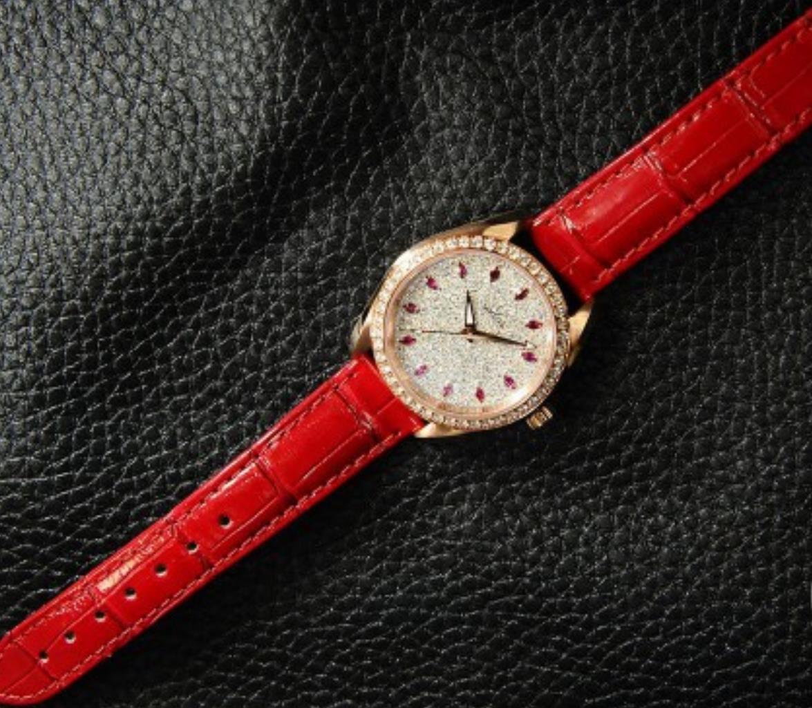 The 34mm replica watch has a red strap.