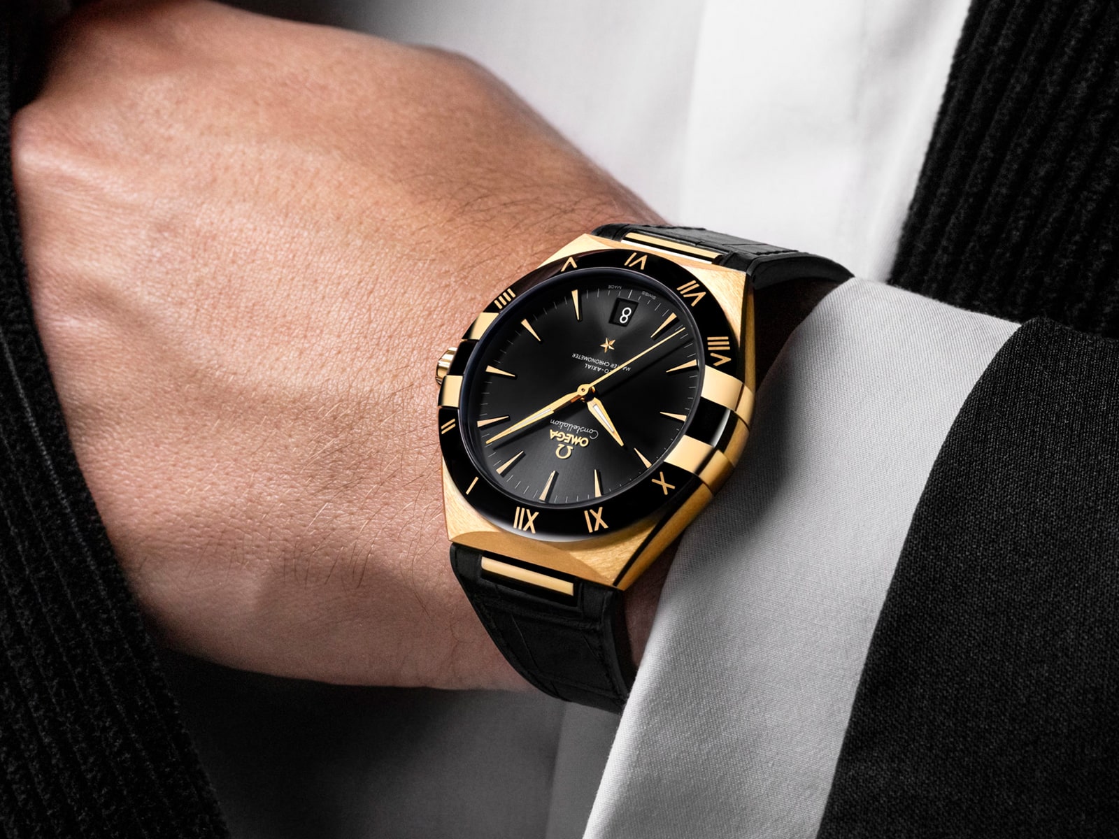 The 18k gold fake watch has a black dial.